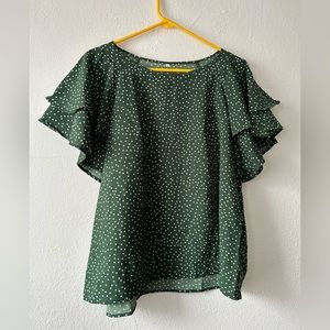 Green and white polka dot flutter sleeve blouse